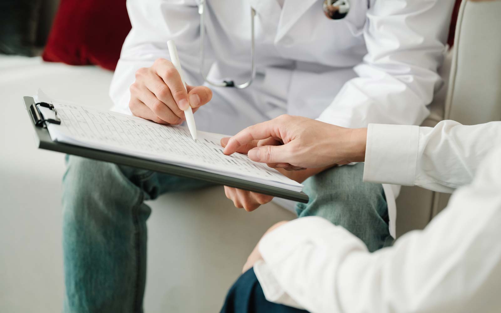 Two people looking at a clipboard